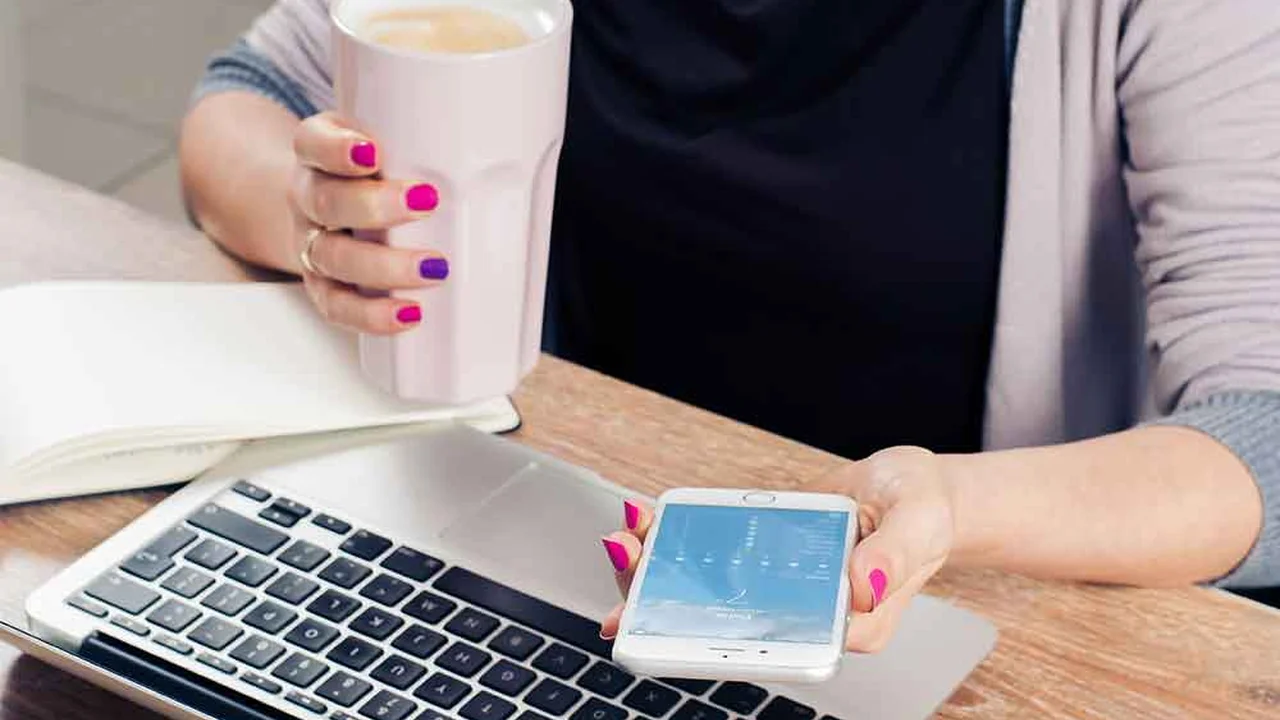 closeup of slices of Pressure Cooker Corned Beef on a platter with potatoes, carrots, and Brussels sprouts